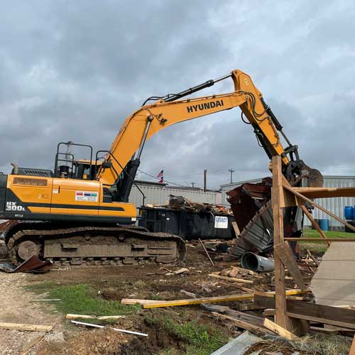 Hyundai Excavator Clearing the Debris